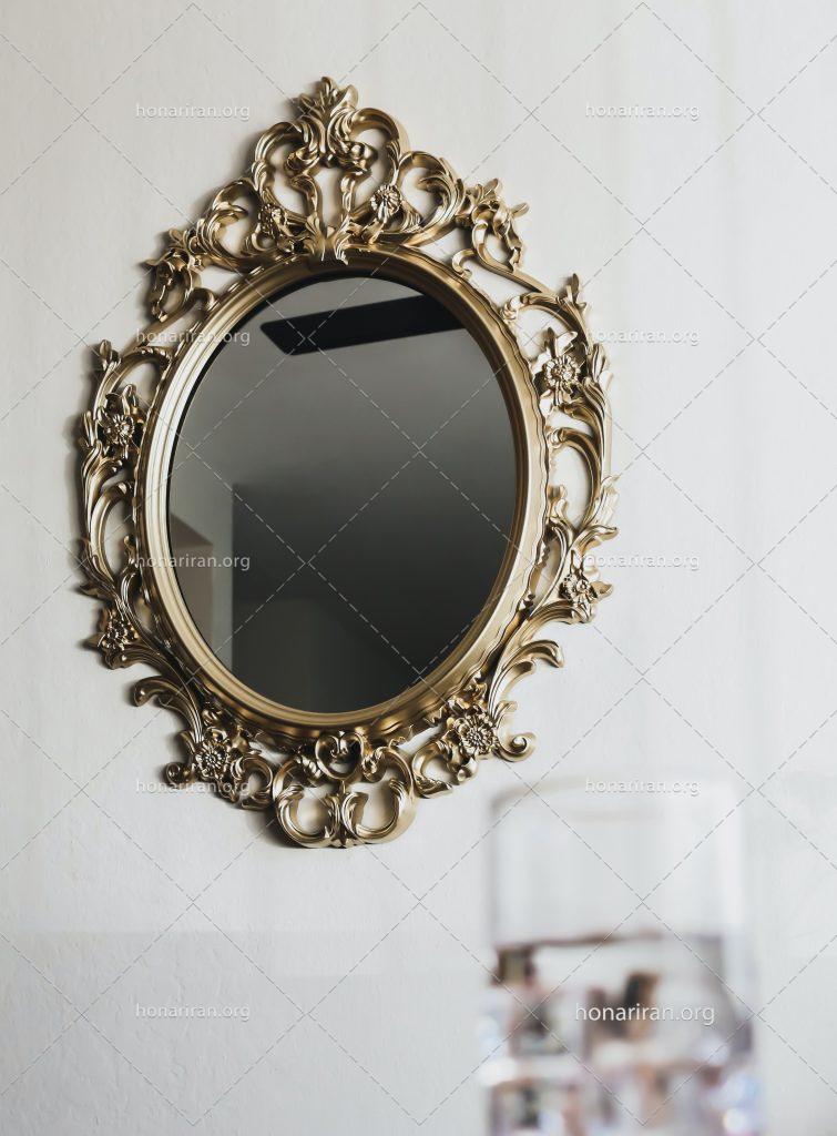 عکس با کیفیت آینه با قاب زیبا به شکل خطوط اسلیمی