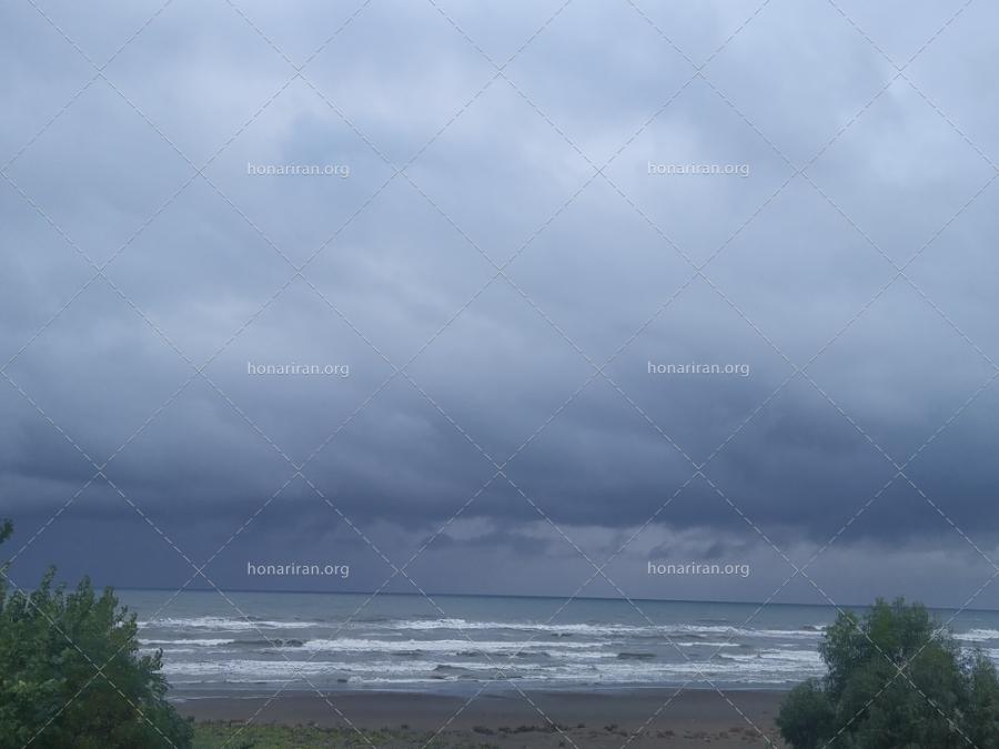 قطعه عکس ابرها بر فراز ساحل